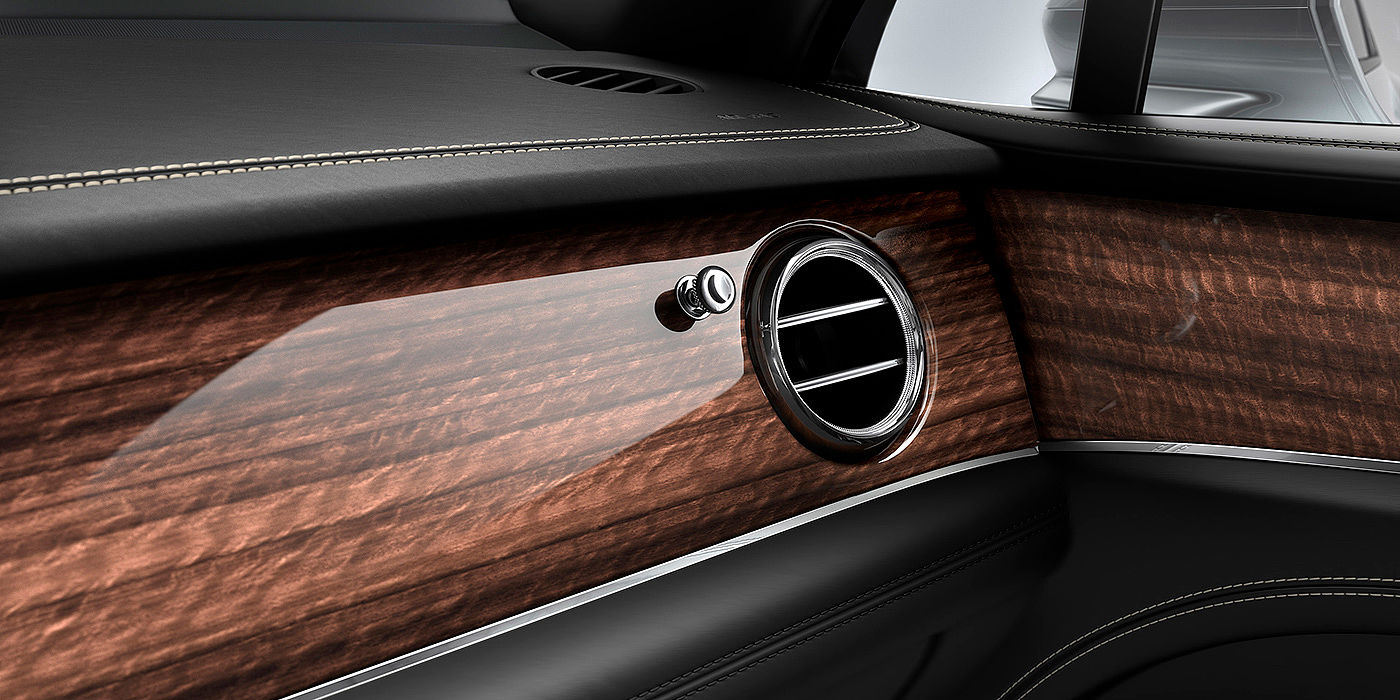 Bentley Guangzhou - Tiyuzhongxin Bentley Bentayga front interior Crown Cut Walnut veneer and chrome air vent.